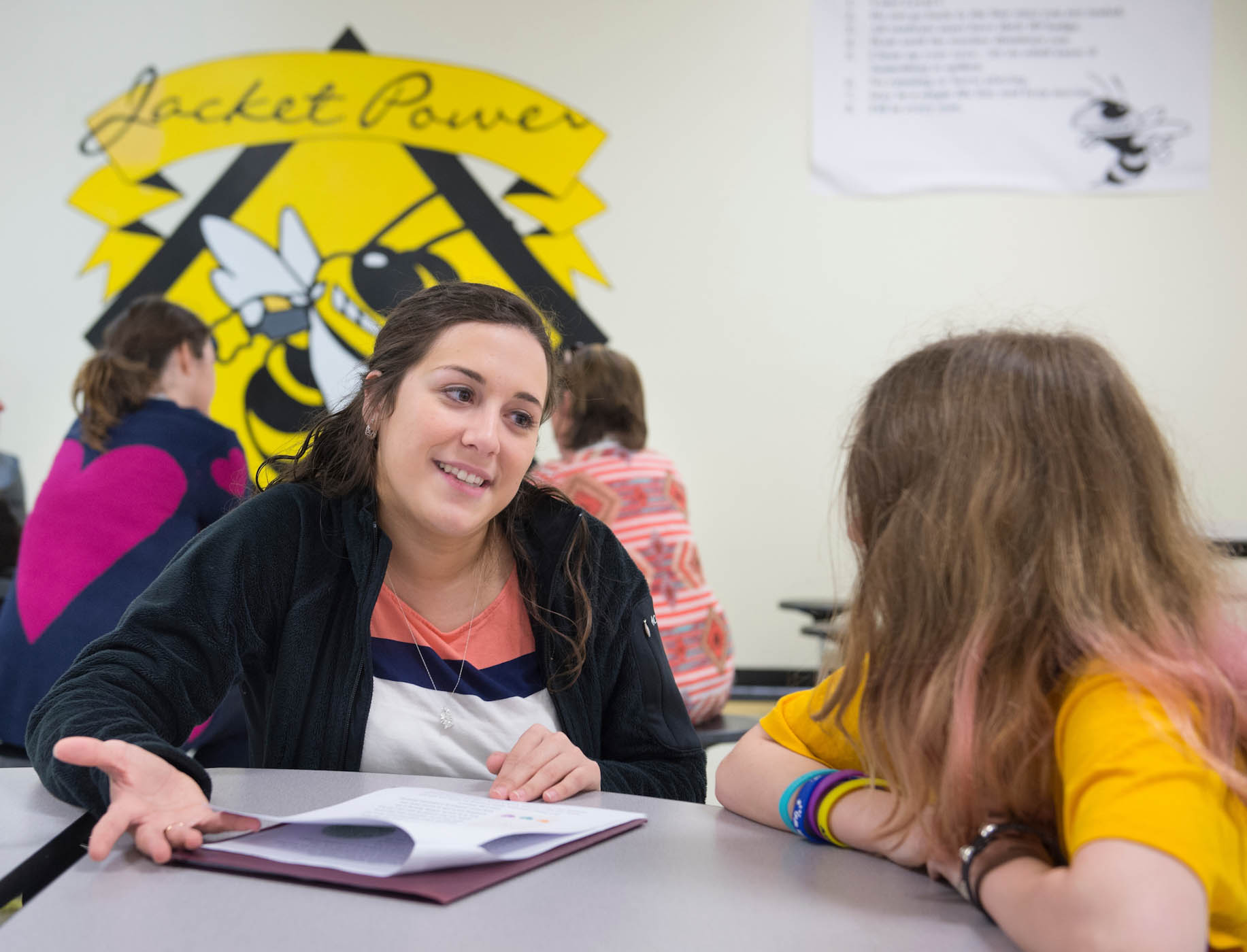 Teacher talking to student