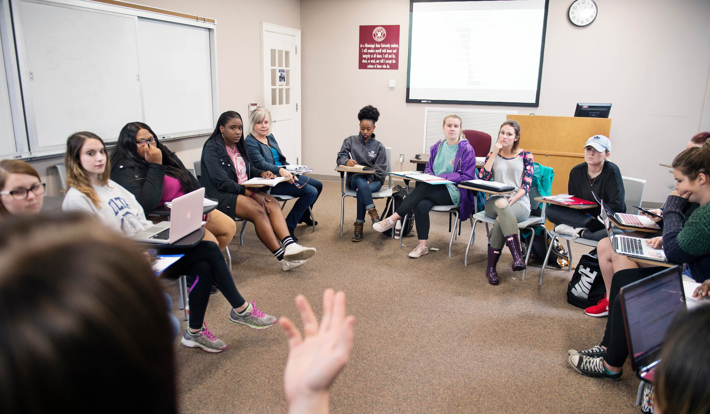 Students discuss in classroom
